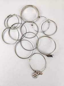 lot 218 image: Lot of Metal Bangle Bracelets with Charms
