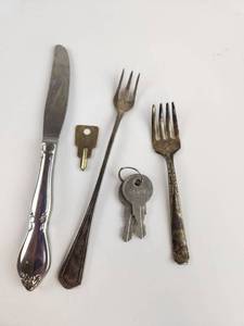 lot 245 image: Lot of 5 Flatware Pieces with Decorative Handle Knife, 2 Forks, Key and Brass Key