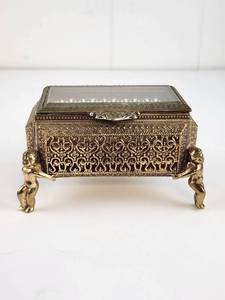 lot 264 image: Vintage Gold Tone Filigree Cherub Footed Jewelry Box Glass Hinged Lid READ