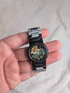 lot 2518 image: LEGO Batman Wristwatch Black and Silver Link Band
