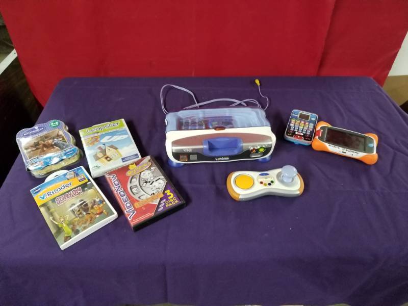 lot 2441 image: V-Tech V Motion and Games with Handhelds