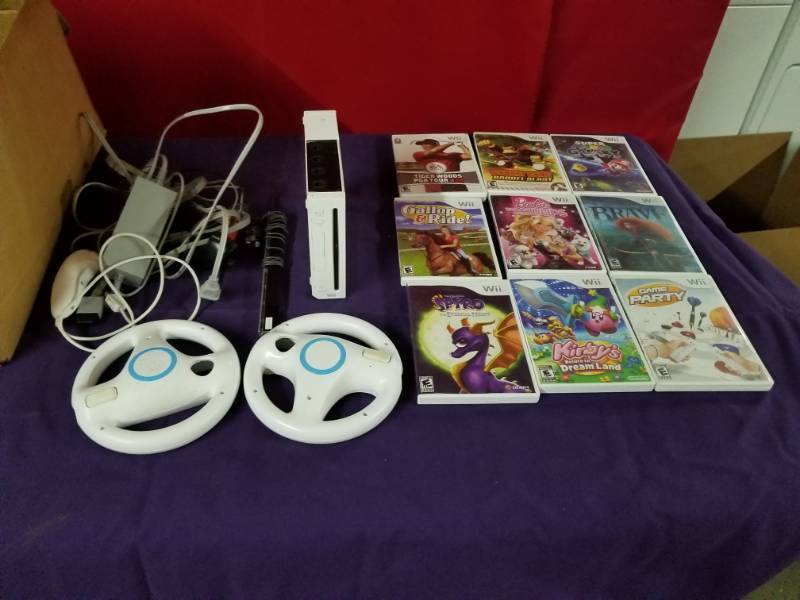 lot 2457 image: Wii System, Nine Games and Accessories