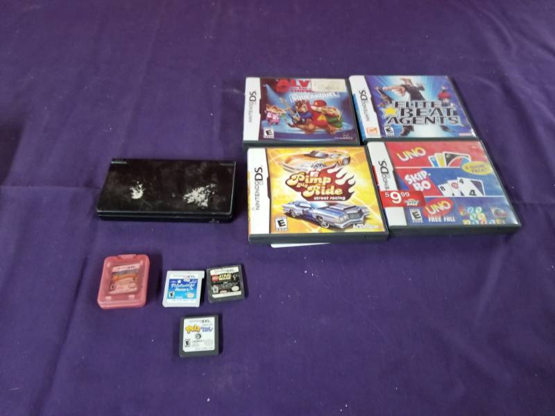 lot 2462 image: Nintendo DS and 8 Games No Charger