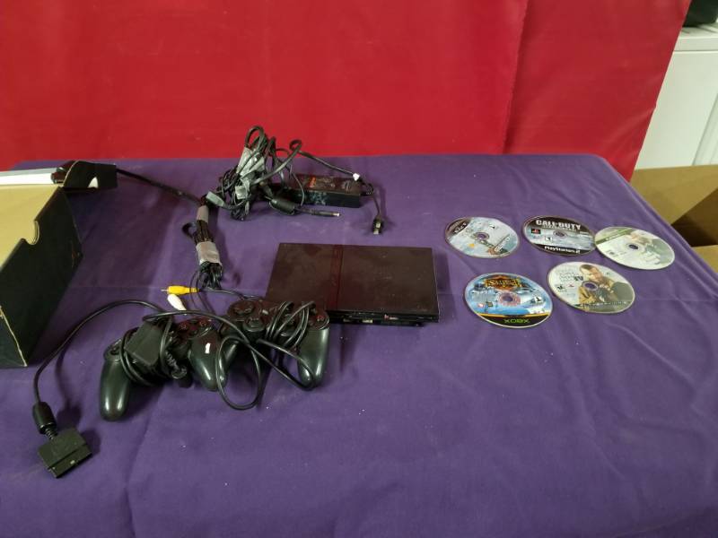 lot 2463 image: Playstation 2, 5 games and  CordsControllers