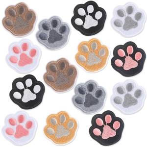 lot 2212 image: 14 Pcs Paw Print Patches - Iron On & Self Adhesive Pet Paw Appliques for Hats, Bags & Jackets - Retail $7