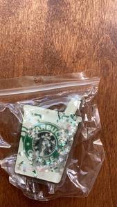 lot 205 image: Starbucks Air Tag Holder with Confetti Design