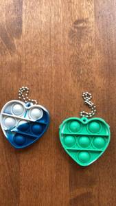 lot 209 image: Pop It Fidget Toy Keychain Heart Shape 2-Pack Blue Green