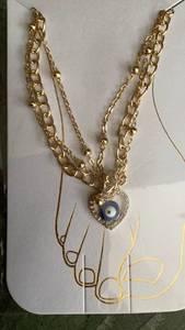 lot 221 image: Gold-Tone Chain anklet with Heart Pendant and Evil Eye