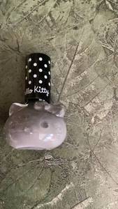 lot 229 image: Hello Kitty Nail Polish Black Cap White Polka Dot grey color