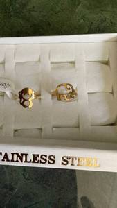 lot 254 image: 2 Stainless Steel Animal Rings Elephant Dog Design rings size 7 gold tone