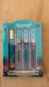 lot 406 image: Syrphing Island Bliss Fragrance & Lip Gloss Set