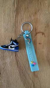 lot 446 image: Keychain with Sneaker Charm and I Love You Strap