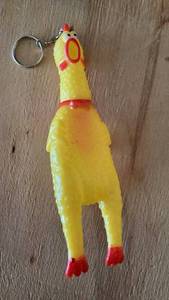 lot 481 image: Yellow Rubber Chicken Keychain with Red Accents