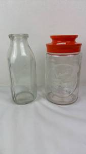 lot 77 image: Glass vase and glass jar with orange Lid