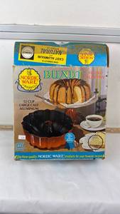 lot 103 image: Nordic Ware 12 Cup Large Cast Aluminum Bundt Fluted Tube Pan