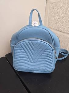 lot 130 image: Light Blue Quilted Faux Leather Backpack with Dual Handles and Shoulder Strap