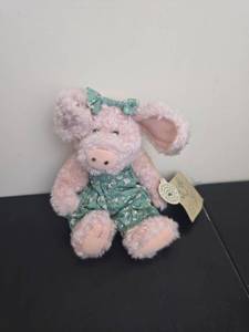 lot 158 image: Pink Plush Pig Stuffed Animal with Green Floral Dress and Bow