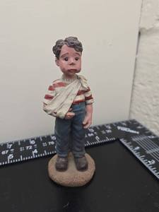 lot 166 image: Boy Figure with Arm Sling Red Striped Shirt Blue Pants