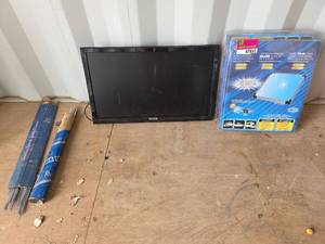 lot 7852 image: Welding Rods, Jensen 24in TV, and 2 Coleman 6w Solar 12v Battery Trickle Chargers
