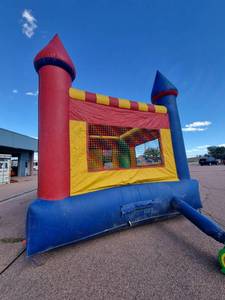 lot 7932 image: Rainbow Inflatable Jump Castle