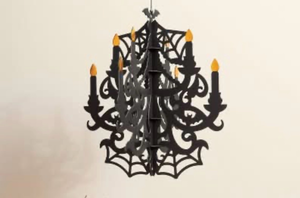 lot 44387 image: Including 2 Halloween Spider Web Chandelier Hanging Decoration with LED Candles and one Paper Spider Scene kit.