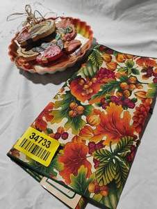 lot 34733 image: Bundle of fall decor, Table runner, carved wood turkey decor, holiday napkins, along with fall leaf decor