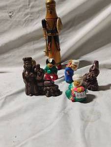 lot 34746 image: Small vintage figurines, including a taller nutcrackercarved wooden figure, and smaller painted ceramic miniature figures