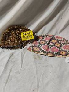 lot 34749 image: Two traditional Nepali Dhaka Topi hats, a pink patterned style and a darker beadedtextured style
