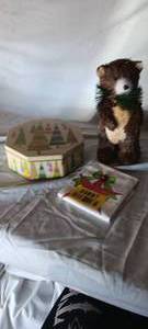 lot 34697 image: Christmas metal tin, Holiday bear decor, and Christmas hand towel