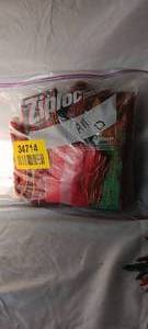 lot 34714 image: Gallon-size bag of Christmas ribbon