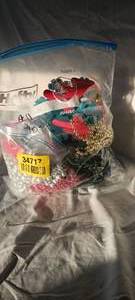 lot 34717 image: Jumbo bag of Christmas decor items, star-shaped lights, snowflakes, silver beads, light bulb necklace, headband antlers