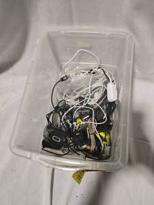 lot 34766 image: Various electronic cords, a computer mouse, and several extension cords