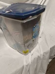 lot 34771 image: Plastic dog food storage container, Plush dog bed, Dog bowl, and bag of dog food