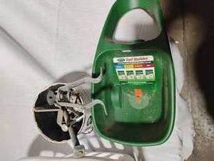 lot 34784 image: Turf builder fertilizer spreader, long bolts, rotating yard sprinkler