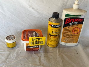 lot 34791 image: Wood filler putty, Wood hardener, stain, and Top coat for wood flooring
