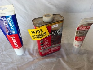 lot 34792 image: Tube of PowerGrab, Kitchen and bath silicone, and paint stripper