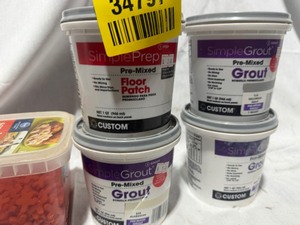 lot 34797 image: 3 Tubs of grout, 1 tub of tile spacers, and 1 container of floor patch