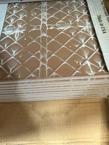 lot 34798 image: Box of tile flooring and a Steamatic spot cleaning kit