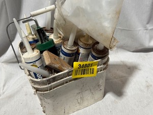 lot 34801 image: Bucket full of Caulk and a caulking gun