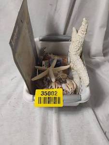 lot 35002 image: Starfish candle holder, seashells bundle, cross-stitch kit