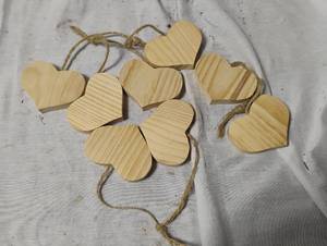 lot 35007 image: 4 sets of wooden heart ornaments, every 2 hearts attached by string ready to be painted