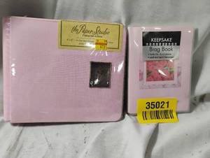 lot 35021 image: Pink memory album 6x6 along with a 6x6 brag book holds 36 photos