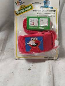 lot 35022 image: Childrens Elmo harness and hand strap in package