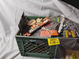lot 35032 image: Crate of Halloween decor, signs, skeleton, ghosts, costume