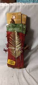 lot 34962 image: Assortment of Christmas decor, gold leaf, tan and red leaf sprays for the Christmas tree