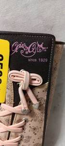 lot 35081 image: Pink lace-up wallet