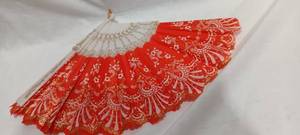 lot 35103 image: Red, cream and gold hand fan