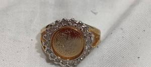 lot 35114 image: Gold round ring with diamonds around the edge