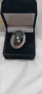 lot 35115 image: Silver ring with black center stone