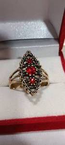 lot 35116 image: Gold costume ring with red stones